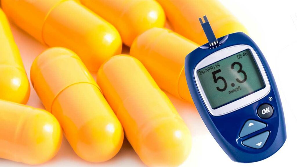 Berberine capsules next to a blood glucose meter